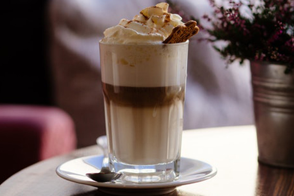 cup of liquid with whipped topping