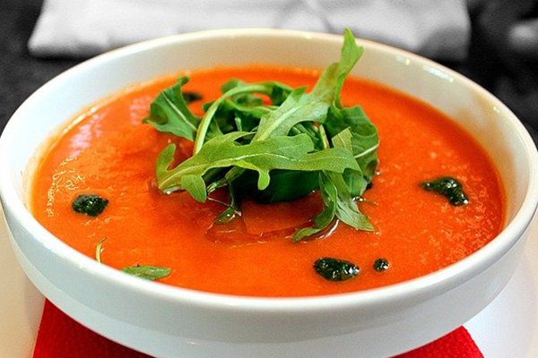 bowl of soup with leafy garnish